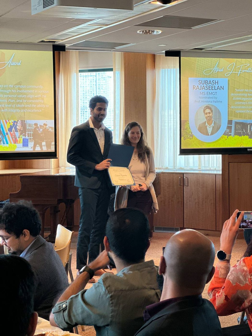 Rajaseelan receiving the Alfred J. Ferretti Excellence in Leadership Award at Northeastern University