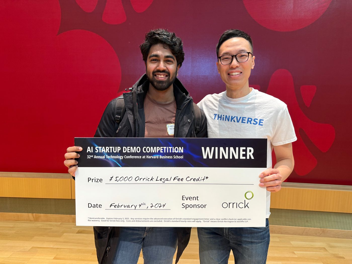 Rajaseelan and Vincent Zhang holding the WINNER check at the Harvard Business School AI Startup Demo Competition